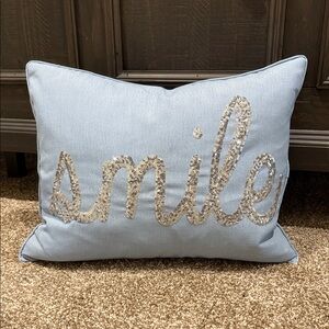 Blue Decorative Pillow with Silver 'Smile' Design
